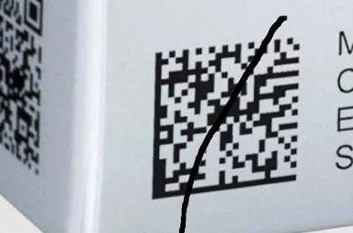 Scratched QR code on a box